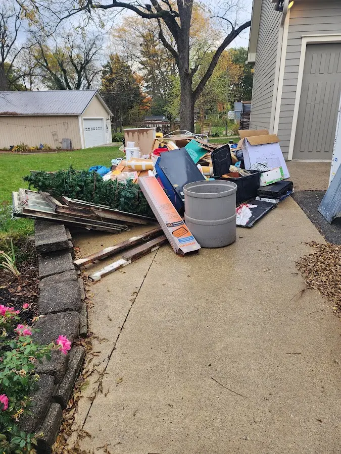 Dumpster being loaded with debris for 30 Yard Dumpster Rental in Cresaptown